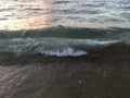 Sunrise Light on Pacific Ocean Waves on Beach in Kapaa on Kauai Island in Hawaii. Royalty Free Stock Photo