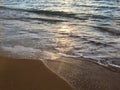 Sunrise Light on Pacific Ocean Waves on Beach in Kapaa on Kauai Island in Hawaii. Royalty Free Stock Photo