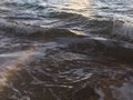 Sunrise Light on Pacific Ocean Waves on Beach in Kapaa on Kauai Island in Hawaii. Royalty Free Stock Photo