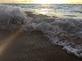 Sunrise Light on Pacific Ocean Waves on Beach in Kapaa on Kauai Island in Hawaii. Royalty Free Stock Photo