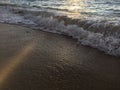 Sunrise Light on Pacific Ocean Waves on Beach in Kapaa on Kauai Island in Hawaii. Royalty Free Stock Photo