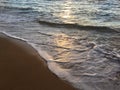 Sunrise Light on Pacific Ocean Waves on Beach in Kapaa on Kauai Island in Hawaii. Royalty Free Stock Photo