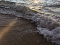 Sunrise Light on Pacific Ocean Waves on Beach in Kapaa on Kauai Island in Hawaii. Royalty Free Stock Photo