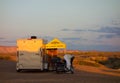 The sunrise lighting up a campsite in the desert