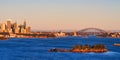 Sunrise Lighting Up Sydney CBD Buildings, the Opera House and Bridge, Australia Royalty Free Stock Photo