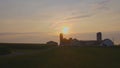Sunrise Looking over an Amish Farm with Farm House Barn and Silos Royalty Free Stock Photo
