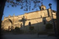 Sunrise in main facade on Church of San Pablo framed by a few branches with blue sky, Ubeda Royalty Free Stock Photo