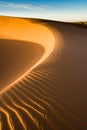 Sunrise makes graphical patterns at the dunes Sahara at Mhamid Royalty Free Stock Photo