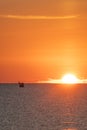 Sunrise in the mediterranean sea with fishing boat Royalty Free Stock Photo