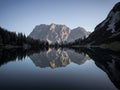 Sunrise mirror reflection of Zugspitze mountain massif in clear calm alpine lake Seebensee in Ehrwald Tyrol Austria alps