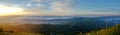 Sunrise with mist, sky and wind turbine