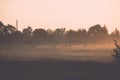 sunrise in misty country meadow - retro vintage look Royalty Free Stock Photo