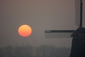 Sunrise misty winter morning with windmill