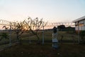 Sunrise in the morning in a place surrounded by barbed guardrails. There is a place of worship for Hindus in a vast expanse of Royalty Free Stock Photo