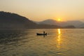 Sunrise in the morning and silhouette small boat