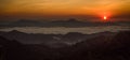 Sunrise on mountains and clouds