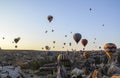 The sunrise in the mountains with Hot air balloons flying over Cappadocia red valley, Goreme, Turkey Royalty Free Stock Photo