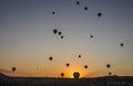 The sunrise in the mountains with Hot air balloons flying over Cappadocia red valley in the sky Royalty Free Stock Photo