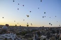 The sunrise in the mountains with Hot air balloons flying over Cappadocia red valley in the sky. Travel to Goreme Royalty Free Stock Photo