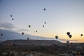 The sunrise in the mountains with Hot air balloons flying over Cappadocia red valley in the sky Royalty Free Stock Photo