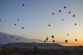 The sunrise in the mountains with Hot air balloons flying over Cappadocia red valley in the sky Royalty Free Stock Photo