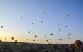 The sunrise in the mountains with Hot air balloons flying over Cappadocia red valley in the sky Royalty Free Stock Photo