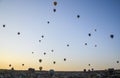 Sunrise in the mountains with Hot air balloons flying over Cappadocia red valley. Travel to Goreme, Turkey Royalty Free Stock Photo