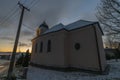 Sunrise near Ctibor and Halze villages in cold snowy morning with chapel