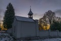Sunrise near Ctibor and Halze villages in cold snowy morning with chapel