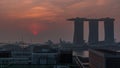 Sunrise near Marina Bay Sands Hotel dominates the skyline at Marina Bay in Singapore aerial timelapse. Royalty Free Stock Photo