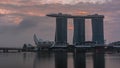 Sunrise near Marina Bay Sands Hotel dominates the skyline at Marina Bay in Singapore timelapse. Royalty Free Stock Photo