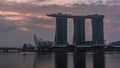 Sunrise near Marina Bay Sands Hotel dominates the skyline at Marina Bay in Singapore timelapse. Royalty Free Stock Photo