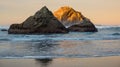 Sunrise on ocean beach with cliffs