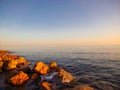 Sunrise ocean breeze stones rocks Royalty Free Stock Photo