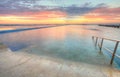 Sunrise from one of the pools to the ocean at North Narrabeen Au Royalty Free Stock Photo