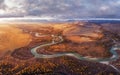 Sunrise over the autumn steppe with the river against the background of mountains Royalty Free Stock Photo