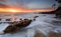 Sunrise over the Bay with ocean over rocks Royalty Free Stock Photo