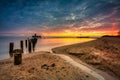 Sunrise over the beach and torpedo platform at Baltic Sea in Babie Doly, Gdynia. Poland Royalty Free Stock Photo