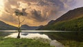 Sunrise over Buttermere lake and the lone tree