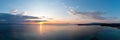 Sunrise over calm ocean aerial panorama. Sunset orange and blue color sky. Chalkidiki, Greece Royalty Free Stock Photo