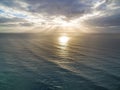 Sunrise over calm ocean water. Royalty Free Stock Photo