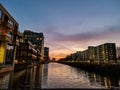 sunrise over a canal in amsterdam during the summer Royalty Free Stock Photo