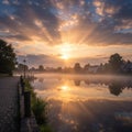 Sunrise over Canal with Misty Village Reflection Royalty Free Stock Photo