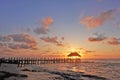 Sunrise over the Caribbean Sea. Waves roll on the beach sand.