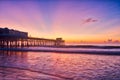 Sunrise over Cocoa Beach Pier in purple blue and orange Royalty Free Stock Photo
