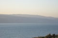 Sunrise over the Dead Sea on a foggy day. A view from Israel To Jordan Mountains. Royalty Free Stock Photo