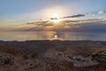 Sunrise  over the Dead Sea near mountains of stone desert near the Khatsatson stream, on the Israeli side of the Dead Sea, near Royalty Free Stock Photo