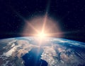 Sunrise over the earth. The elements of this image furnished by NASA Royalty Free Stock Photo