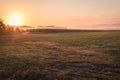 Sunrise over a farm field in early fall Royalty Free Stock Photo