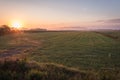 Sunrise over a farm field in early fall Royalty Free Stock Photo